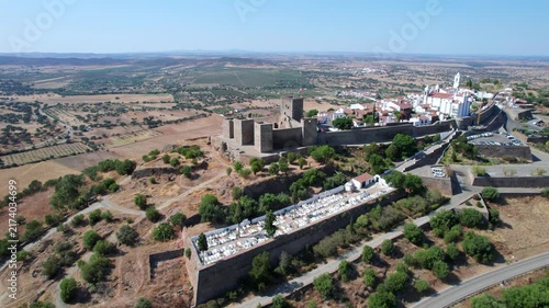 Stunning aerial footage of the historic hilltop village of Monsaraz and its ancient castle, overlooking the Alentejo landscape in Portugal