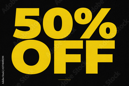 Bold yellow 50% OFF sale promotion text on black background, high contrast discount banner for retail marketing, ecommerce ads and social media