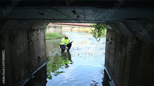 Engineer Conducting Infrastructure Inspection in Underground Stormwater Drainage Channel