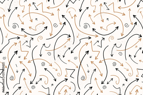 Hand drawn seamless pattern with black and brown arrows, swirls, and scribbles on cream background