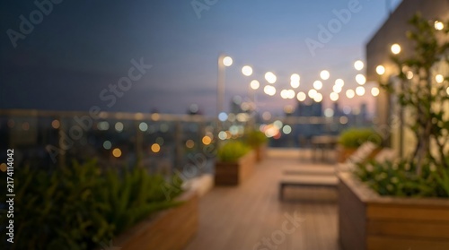 A beautifully decorated rooftop patio at dusk, illuminated by soft string lights, with city lights twinkling in the background
