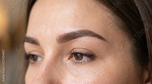 Close up of a woman's perfectly shaped eyebrows and eye