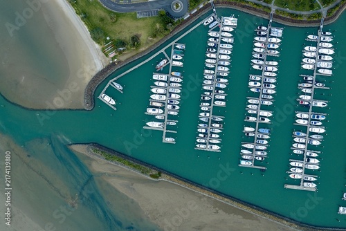 Canvastavla Aerial top-down view of boats and yachts safely docked and moored at a Marina in Whangamata, New Zealand for storage