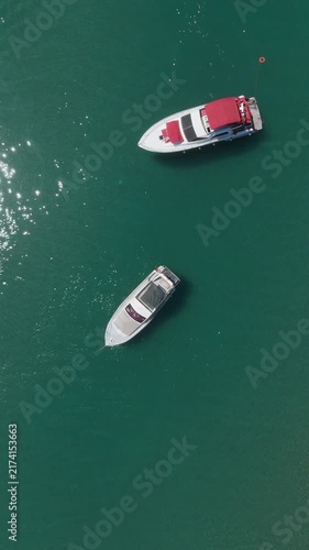 Aerial of view of a yachts in the middle of turquoise sea by summer	