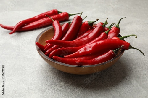 Konstfotografi Aromatic spice. Fresh chili peppers on grey table, closeup