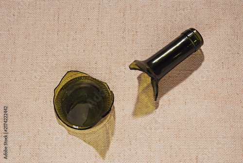 neck and bottom of a broken  wine bottle