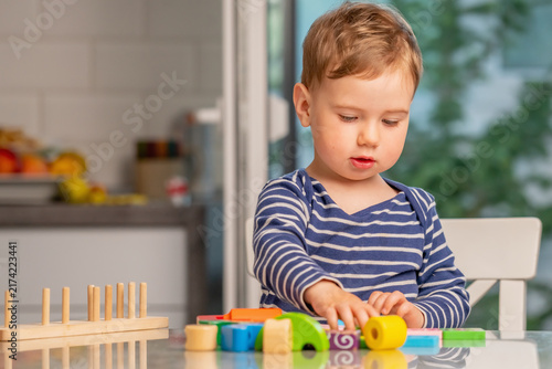 Early childhood development through play with colorful wooden toys. Copy space for text or design.