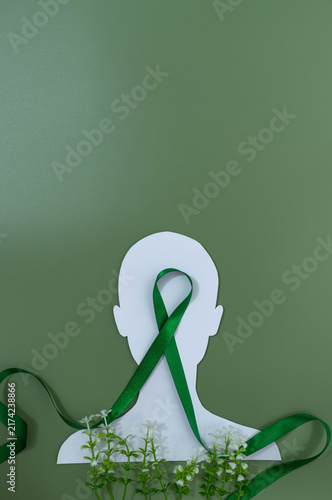 Mental health awareness concept with green ribbon