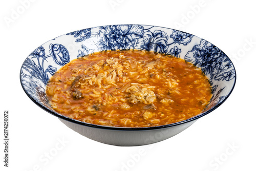 Hearty rice stew bowl with meat chunks and rich broth