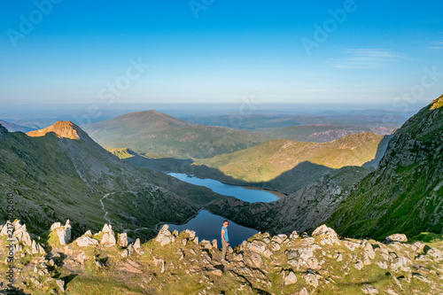 Obraz na płótnie Backpack hiker in Snowdon Mountain, Highest Peak in Wales, United Kingdom, Summe