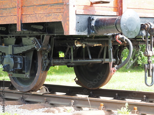 Naklejka Iron wheels and springs of a railway wagon