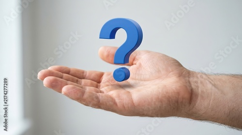 A person presenting a blue question mark floating above an open hand.