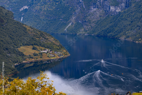 Bild auf Leinwand A beautiful landscape of Geirangerfjord boat in the fjord waters