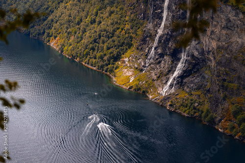 Bild auf Leinwand A beautiful landscape of Geirangerfjord boat in the fjord waters