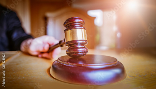 Obraz na płótnie Macro Close-up of Judge's Gavel and Sound Block on Courtroom Table