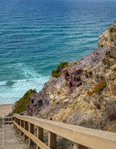 Scenic coastal view looking down a wooden stairway