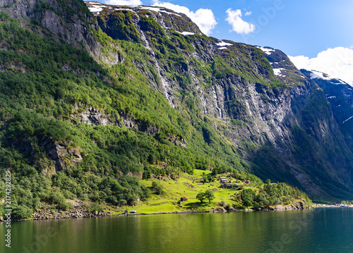 Nereid Fjord is one of Norways most picturesque fjords, and its surroundingswith their steep, green slopes and waterfallsare listed as a UNESCO World Heritage Site.