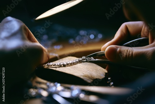 Skilled Jewelry Maker Designing and Setting Sparkling Necklace in Workshop