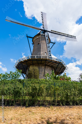 Traditional dutch windmill rising in a garden
