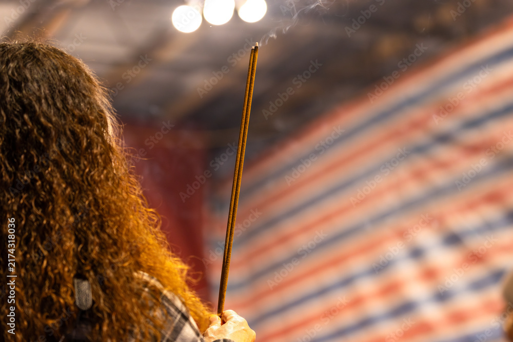 Obraz premium Worshippers Holding Incense at Xiahai City God Temple