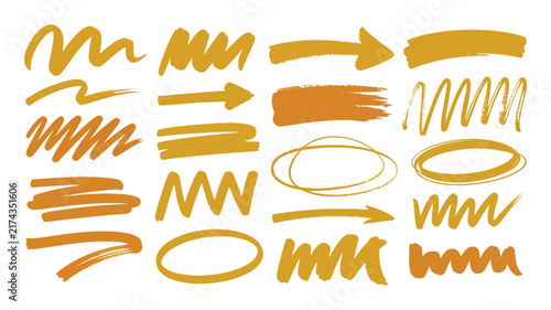 Set of gold handdrawn brush strokes and arrows on white background