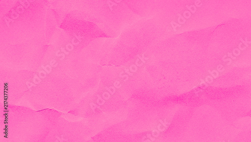 Crumpled pink paper texture background for creative design projects