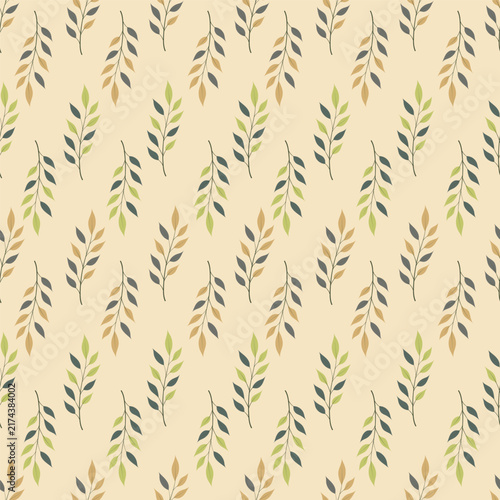Seamless pattern with autumn leafy branches in green and ochre colors on beige background