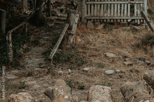 Fotografie old forgotten wooden stairway railing and fence farm