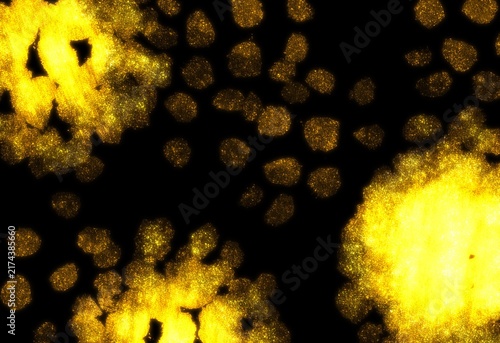Abstract golden glitter particles and glowing dust clouds on a deep black background, creating a dramatic luxurious light effect with sparkling bokeh and generous copy space. Ideal for festive designs