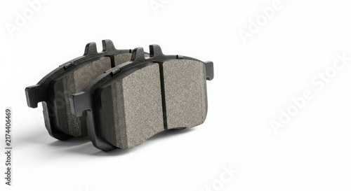 Brake pads for car wheels displayed on white background capturing high quality automotive spare parts with clean studio lighting setup