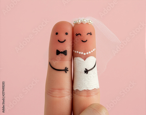 Fingers painted as bride and groom with veil and bowtie