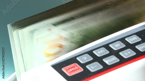 Counting US dollars in a currency counter. Commercial and business concept. Financial background. Close up
