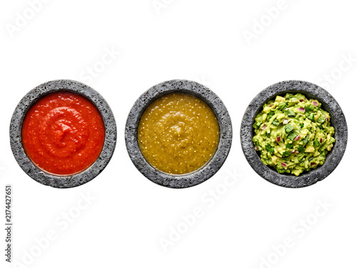Three stone bowls filled with salsa, guacamole, and salsa verde dips sauces salsa, guacamole, salsa verde, dips, sauces, condiments, mexican food, appetizer, starter, food, ingredients, healthy food, 