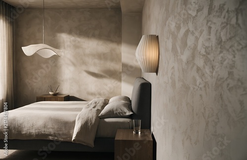 Minimalist bedroom with pendant light upholstered bed and textured walls | Refined contemporary interior emphasizing comfort materials and ambient lighting