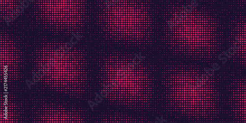 Abstract red halftone circular pattern background on dark blue for retro technology texture.