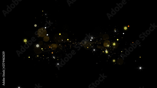 Fotografie Golden magic dust particles and bokeh glowing on black background