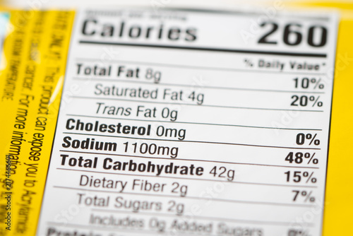 Nutrition facts label on a packaged instant noodle ramen, highlighting high sodium content.