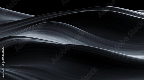 Abstract black and white photograph of a wave-like pattern. the wave appears to be made up of thin, wavy lines that create a sense of movement and depth.