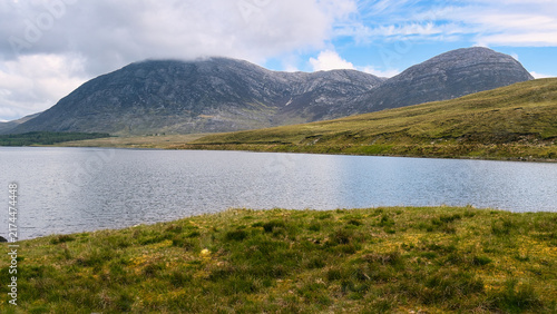Obraz na płótnie Lough Inagh landscape in Connemara National Park with rugged mountains, reflecti