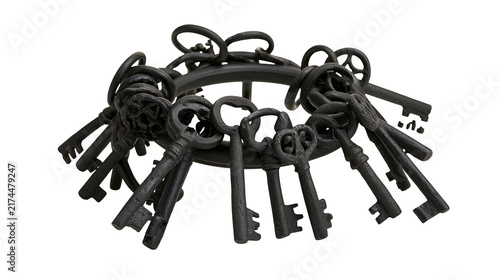 фотографія Isolated rustic dark cast iron skeleton keys on an old metal ring, historical vi
