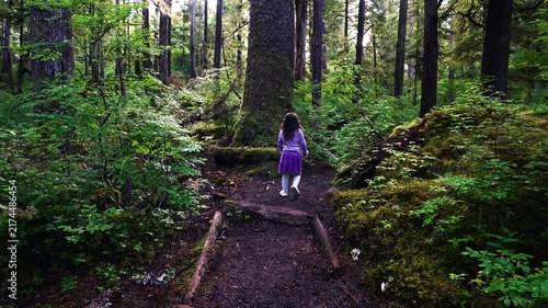 child walking through enchanted forest