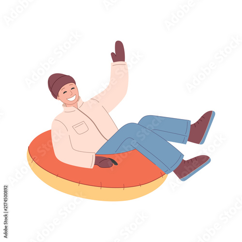 Snow tubing winter activity. Man riding an inflatable snow tube.