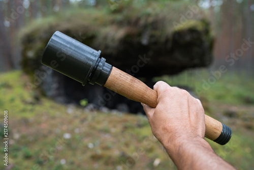 Fotografía Close-up of a hand holding a historical German stick grenade replica, also known