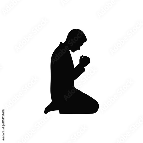 Man kneeling in prayer with folded hands shown as a solid black silhouette.