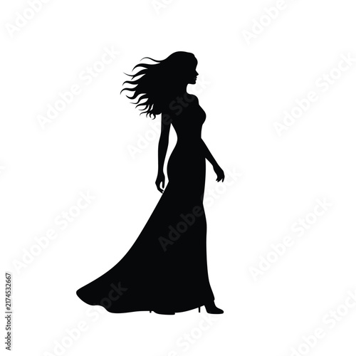 Woman silhouette wearing a long evening gown stands against a white background.