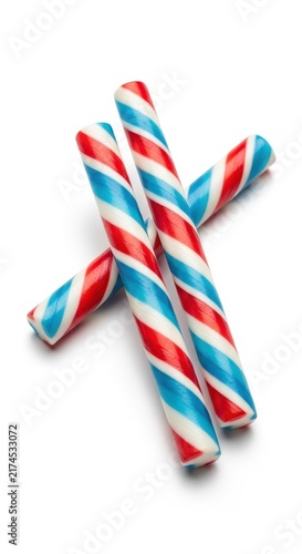 Colorful striped candy canes on white background.