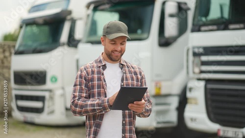 Truck driver managing fleet logistics with digital tablet