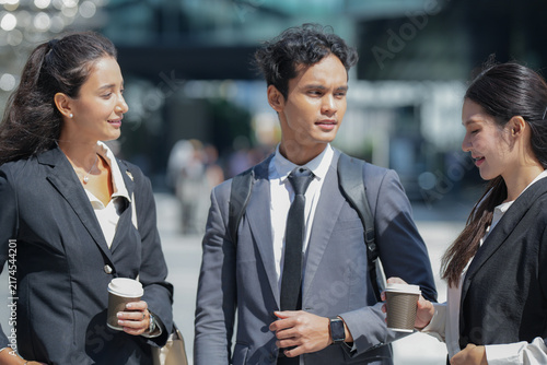 Canvastavla A confident multicultural business trio walking in step while discussing the wor