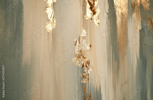 Abstract painting with textured gold leaf streaks on a muted blue and beige background