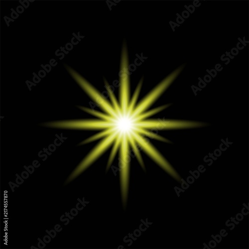 Bright yellow starburst light effect with glowing rays isolated on a solid black background for graphic design